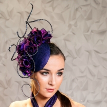 headpiece by guibert with purple roses
